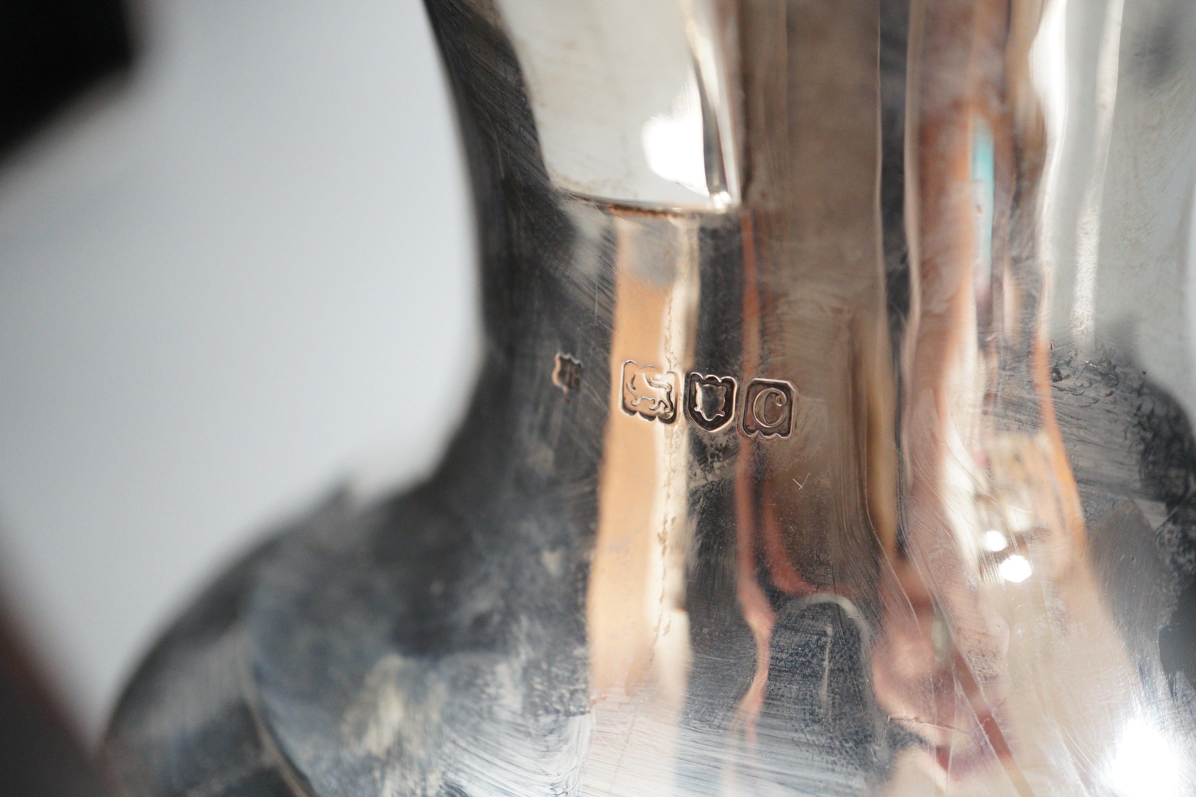 A late Victorian demi-fluted silver coffee pot, Gibson & Langman (Goldsmiths & Silversmiths Co Ltd), London, 1898, height 22.8cm
